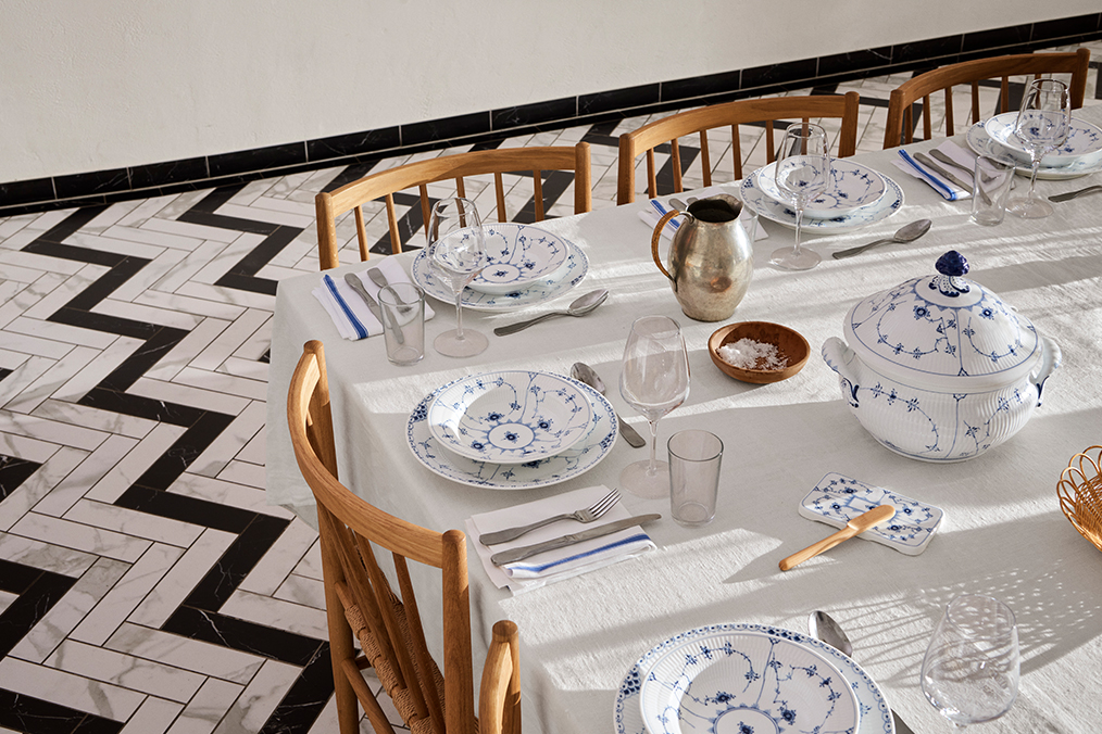 A beautiful dinner table set with the Blue Fluted Plain collection